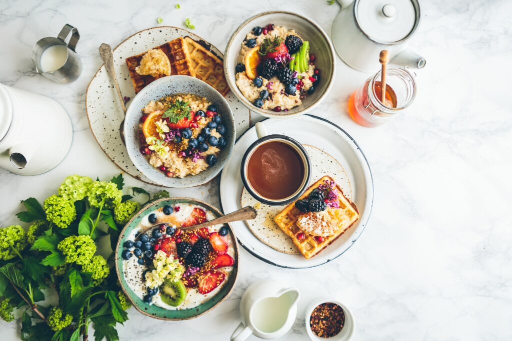 Bowls of Anti-Inflammatory Foods including Berries, Fruits, Oatmeal